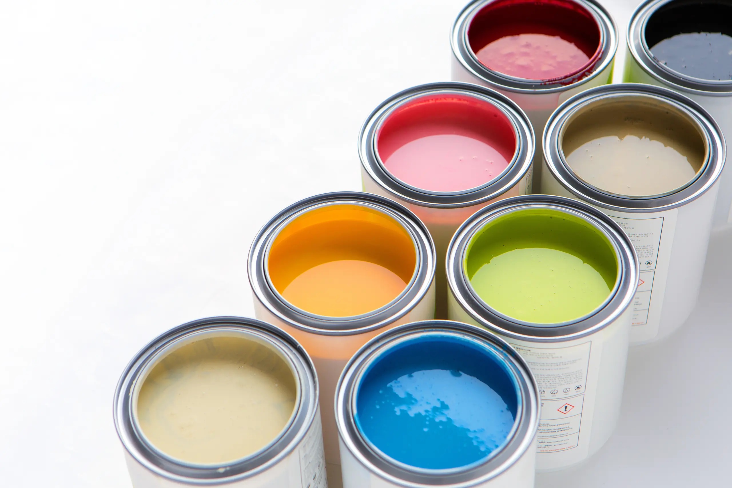 line_of_paint_cans_white_background